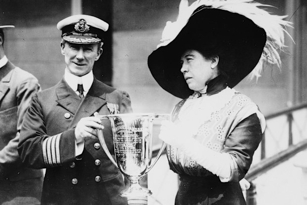 Sir Arthur Henry Rostron, captain of the RMS Carpathia, is presented with a trophy cup by American socialite and Titanic survivor Molly Brown in New York, May 29, 1912. 
