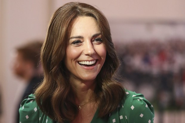 Kate the Duchess of Cambridge smiles next to Britain's Prince William during a meeting with Galway Community Circus performers, local artists and young musicians in Galway, Ireland, Thursday, March 5, 2020. The Duke and Duchess of Cambridge visit Galway on the last of a three-day official visit to Ireland. (AP Photo/Peter Morrison, Pool)