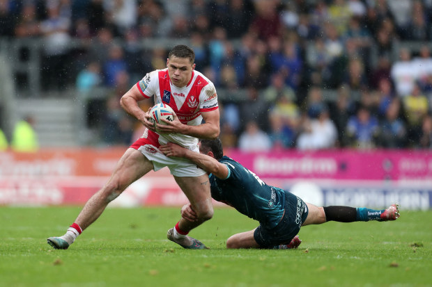 ST HELENS, ENGLAND - SEPTEMBER 30: Jack Welsby of St.Helens is tackled by Stefan Ratchford of Warrington during the Betfred Super League Play-Off match between St Helens and Warrington Wolves at Totally Wicked Stadium on September 30, 2023 in St Helens, England. (Photo by Jess Hornby/Getty Images)