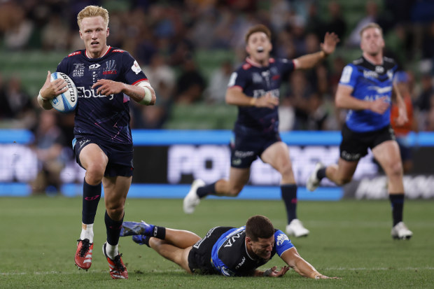 Carter Gordon of the Rebels scores a try.