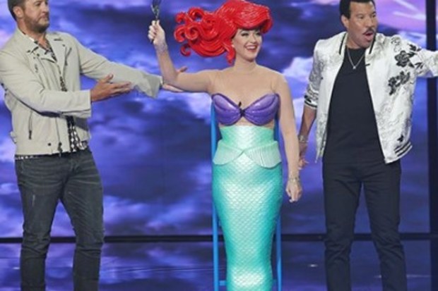 Katy Perry falls off her chair while dressed as the Little Mermaid on American Idol 