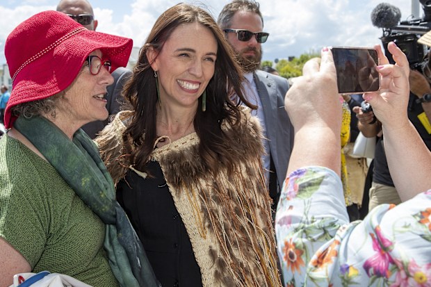 New Zealand Prime Minister Jacinda Ardern, centre, has a photo taken as she arrives at Ratana, New Zealand, Tuesday, Jan. 24, 2023.  