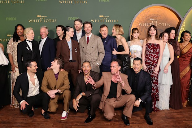 LOS ANGELES, CALIFORNIA - FEBRUARY 10: (L-R) Morgana O'Reilly, Natasha Rothwell, Julian Kostov, Carrie Coon, Mike White, Sam Nivola, Arnas Fedaraviius, Charlotte Le Bon, David Bernad, Nicholas Duvernay, Patrick Schwarzenegger, Jason Isaacs, Walton Goggins, Leslie Bibb, Tayme Thapthimthong, Lisa, Aimee Lou Wood, Sarah Catherine Hook, Parker Posey, Shalini Peiris and Lek Patravadi attend the Los Angeles Premiere of HBO Original Series "The White Lotus" Season 3 at Paramount Theatre on February 10,