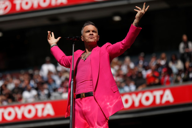 Robbie Williams performs during the 2022 AFL Grand Final match between the Geelong Cats and the Sydney Swans at the Melbourne Cricket Ground.