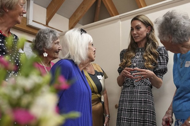 Britain's Catherine, Princess of Wales, talks to members as she visits the National Federation of Women's Institute (WI) to commemorate the three-year anniversary of the death of Queen Elizabeth II in Sunningdale, England, Monday, Sept. 8, 2025.(AP Photo/Alastair Grant, Pool)