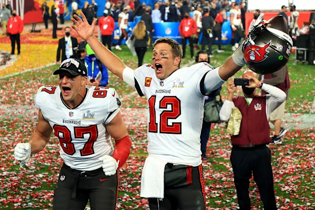 TAMPA, FLORIDA - FEBRUARY 07: Rob Gronkowski #87 and Tom Brady #12 of the Tampa Bay Buccaneers celebrate after defeating the Kansas City Chiefs in Super Bowl LV at Raymond James Stadium on February 07, 2021 in Tampa, Florida. The Buccaneers defeated the Chiefs 31-9. (Photo by Mike Ehrmann/Getty Images)