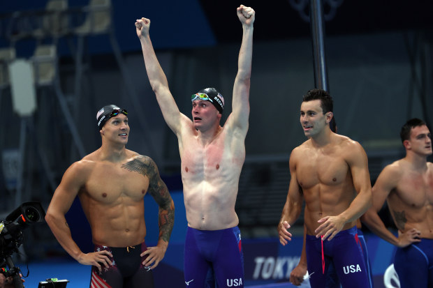 Caeleb Dressel (left) with his USA relay teammates.