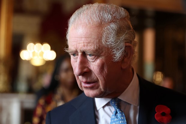 King Charles III talks with guests during a reception and ceremony commemorating the 50th anniversary of the Resettlement of British Asians from Uganda in the UK, at Buckingham Palace in London, Nov. 2, 2022 