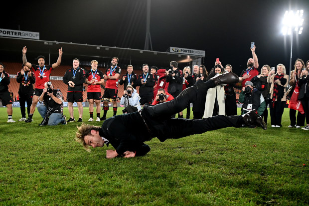 Coach Scott Robertson of the Crusaders breakdances after winning.