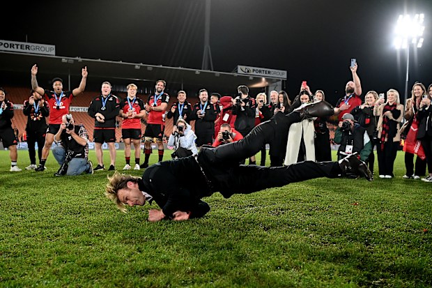 Coach Scott Robertson of the Crusaders breakdances after winning.