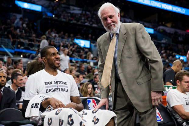 SAN ANTONIO, TX - MARCH 19:  Head Coach Gregg Popovich talks with LaMarcus Aldridge #12 of the San Antonio Spurs during the game against the Sacramento Kings on March 19, 2017 at the AT&T Center in San Antonio, Texas. 