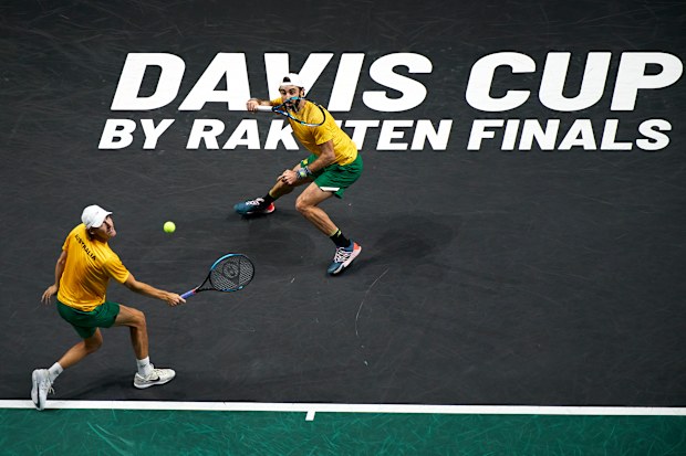 Jordan Thompson of Australia and Max Purcell of Australia returns a ball against Nikola Mektic of Croatia and Mate Pavic of Croatia during the Davis Cup by Rakuten Finals 2022 semi finals match between Australia and Croatia at Palacio de los Deportes Jose Maria Martin Carpena on November 25, 2022 in Malaga, Spain. (Photo by Manuel Queimadelos/Quality Sport Images/Getty Images)