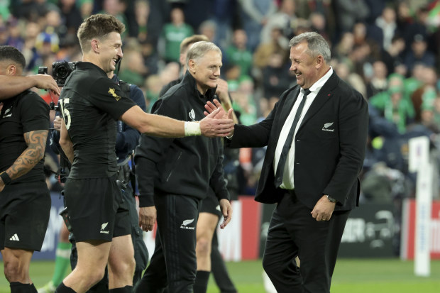 Beauden Barrett and Ian Foster celebrate the victory over Ireland at Stade de France.