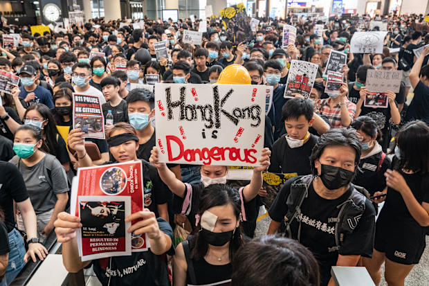August 12: Protesters occupy the arrival hall of the Hong Kong International Airport during a demonstration. 