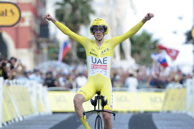 Race leader and yellow jersey Tadej Pogacar of Slovenia and UAE Team Emirates celebrates while crossing the finish line of the 111th Tour de France 2024, Stage 21.