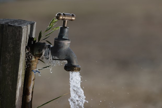A tap with water coming out of it.