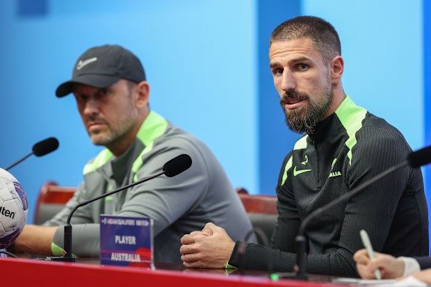 Milos Degenek addresses media.
