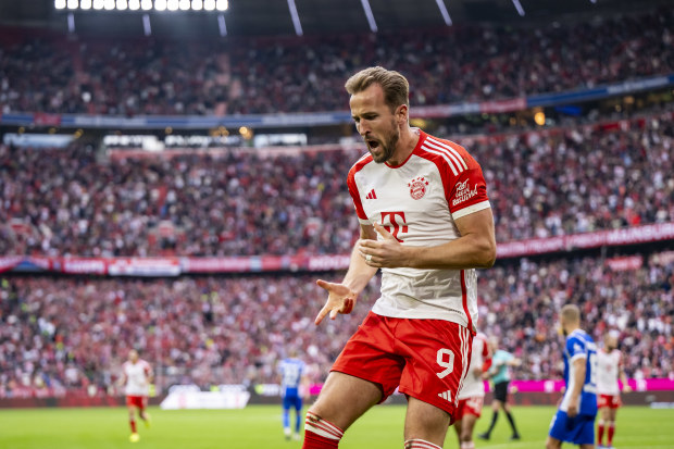 Harry Kane celebrates scoring one of his three goals for Bayern Munich.