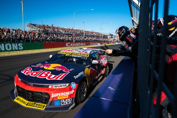 Shane van Gisbergen is greeted by team members at the pit wall after winning the Bathurst 1000.