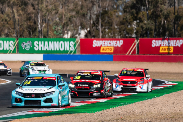 Brad Harris leads Michael Clemente and Aaron Cameron early in race two at Queensland Raceway.