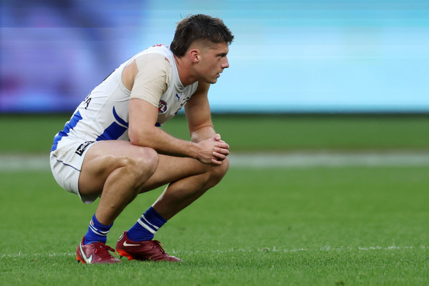 PERTH, AUSTRALIA - JULY 30: Darcy Tucker of the Kangaroos reacts after the teams defeat during the 2023 AFL Round 20 match between the West Coast Eagles and the North Melbourne Kangaroos at Optus Stadium on July 30, 2023 in Perth, Australia. (Photo by Will Russell/AFL Photos via Getty Images)