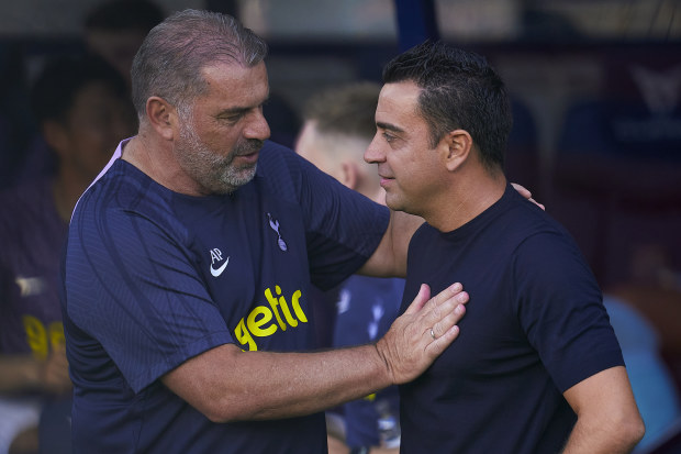BARCELONA, SPAIN - AUGUST 08: Xavi Hernandez, head coach of FC Barcelona salutes Ange Postecoglou, head coach of Tottenham Hotspur ahead the Joan Gamper Trophy match between FC Barcelona and Tottenham Hotspur at Estadi Olimpic Lluis Companys on August 08, 2023 in Barcelona, Spain. (Photo by Pedro Salado/Quality Sport Images/Getty Images)