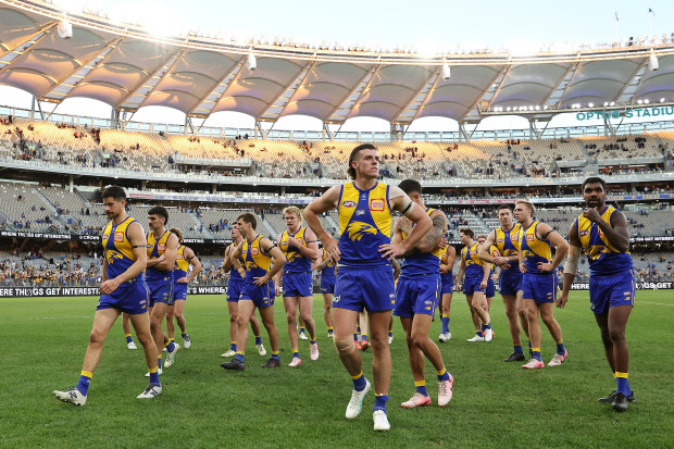 The Eagles leave the field after their loss to Hawthorn.