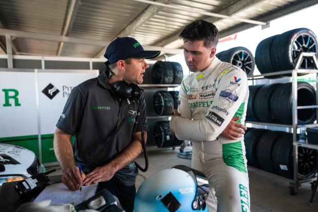 Jordan Cox talks to one of his Garry Rogers Motorsport crew members.
