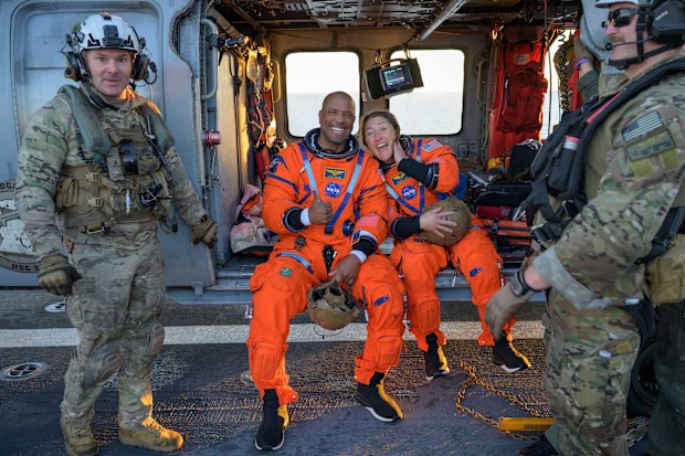 Commander Reid Wiseman, pilot Victor Glover, Christina Koch and Canada's Jeremy Hansen hit the atmosphere travelling Mach 33, or 33 times the speed of sound, a blistering blur not seen since NASA's Apollo moonshots of the 1960s and 1970s.