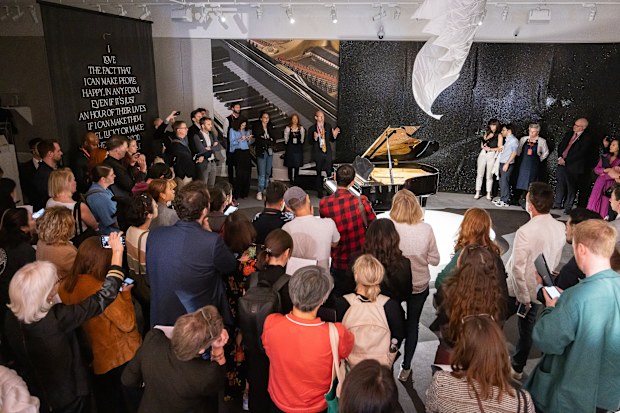 Guests view a Yamaha Baby Grand Piano owned by Freddie Mercury on display at Sotheby's on August 03, 2023 in London, England.   