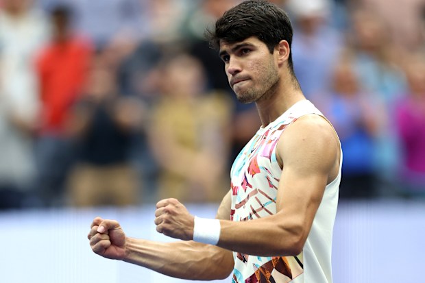 Carlos Alcaraz of Spain celebrates match point against Matteo Arnaldi of Italy during their Men's Singles Fourth Round match on Day Eight of the 2023 US Open at the USTA Billie Jean King National Tennis Center on September 04, 2023 in the Flushing neighborhood of the Queens borough of New York City.  (Photo by Clive Brunskill/Getty Images)