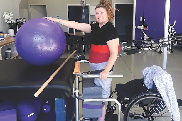 Allison Wilcox doing physical therapy with Making Strides.