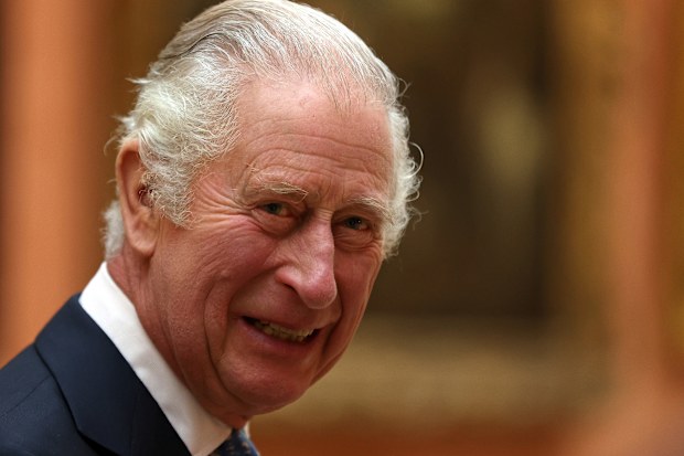 King Charles III meets members of the Westend Gospel Choir after a ceremony commemorating the 50th anniversary of the Resettlement of British Asians from Uganda at Buckingham Palace on November 2, 2022. (Photo by Isabel Infantes - WPA Pool/Getty Images)