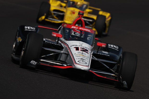 Will Power (No.12) is followed by Scott McLaughlin (No.3) in practice for the Indianapolis 500.
