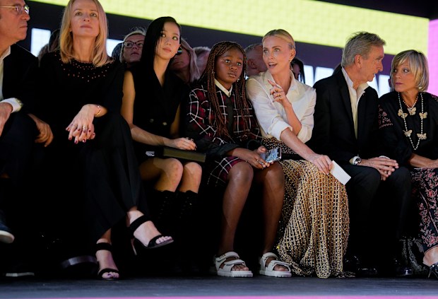 Charlize Theron and daughter Jackson, 11, in the front row of the Dior show at Paris Fashion Week.
