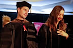 Miranda Kerr and husband Evan Spiegel surprise graduating college students by paying off all $14 million of their student loans.