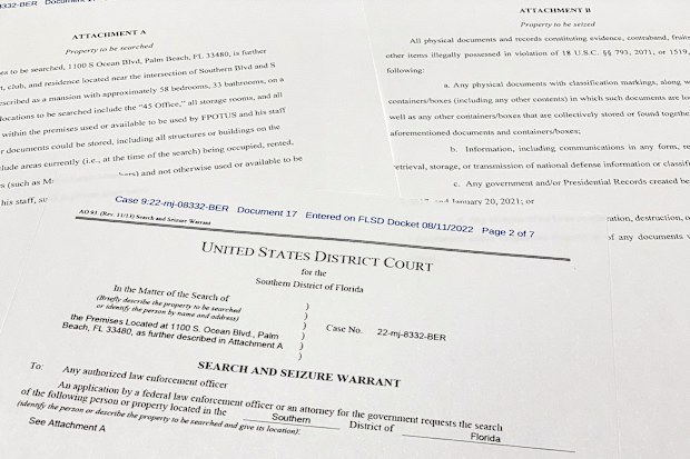 The FBI's unsealed search warrant for former President Donald Trump's Mar-a-Lago estate in Palm Beach, Fla., is photographed Friday, Aug. 12, 2022. (AP Photo/Jon Elswick)