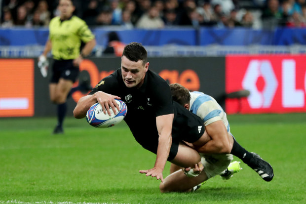 Will Jordan of New Zealand scores his team's seventh try.