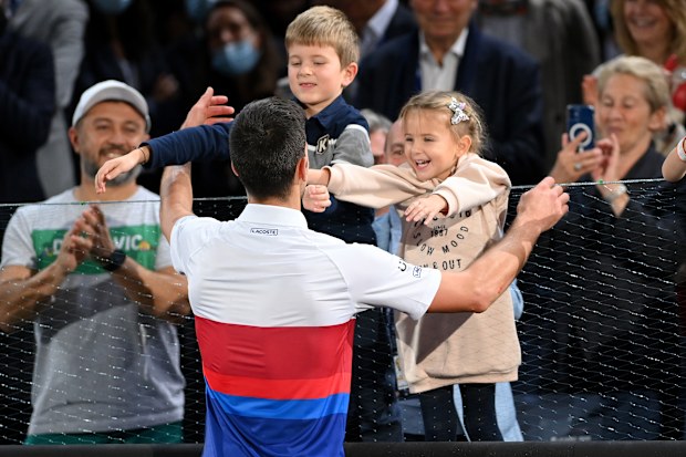 Novak Djokovic of Serbia celebrates with his son, Stefan Djokovic (L) and daughter, Tara Djokovic (R) after winning the men's singles final at the Paris Masters, 2021. 