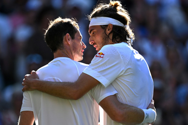 Andy Murray and Stefanos Tsitsipas embrace after the Greek ace defeated Great Britain's best.