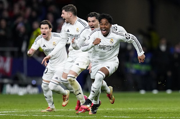 Real Madrid's Endrick, right, and his teammates run celebrating after a penalty shootout against Atletico Madrid.