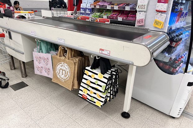 shopping bags at supermarket groceries coles woolworths aldi 