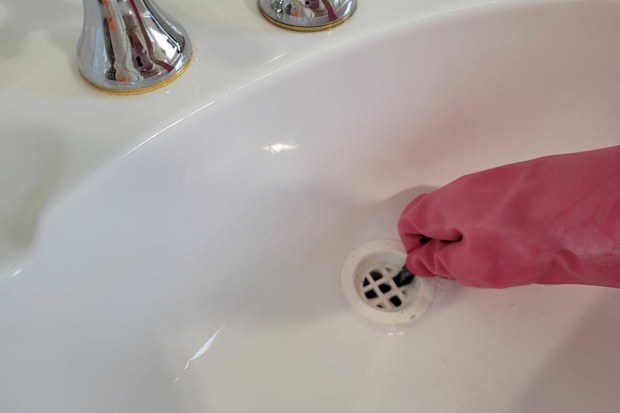 Bathroom basin sink hole cleaning task