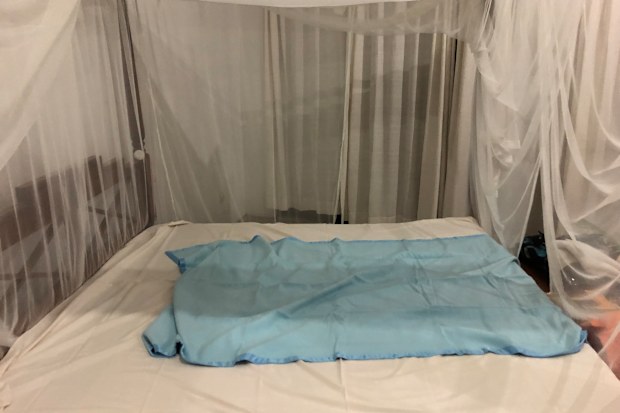 Tiny blanket on large bed