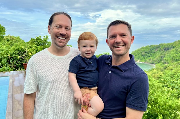 Ben Harris and Danny Cowan with their son Lachlan in the Philippines.