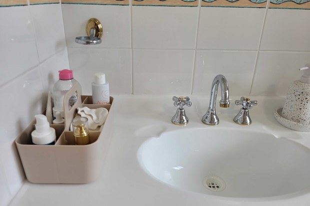 Kmart art and craft caddy used as a skincare organiser on bathroom vanity, which can be removed and put in the cabinet below