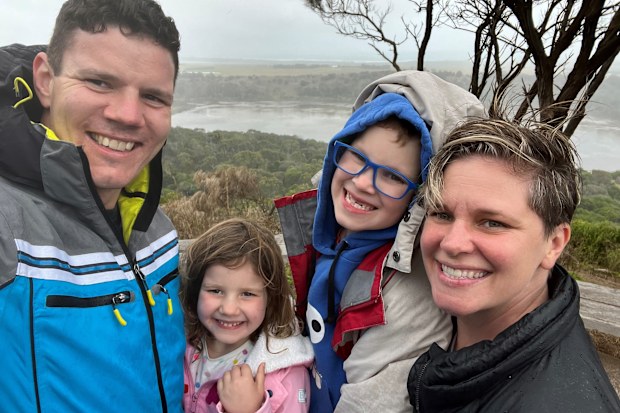 Isla with her mum, dad and brother after cancer treatment.