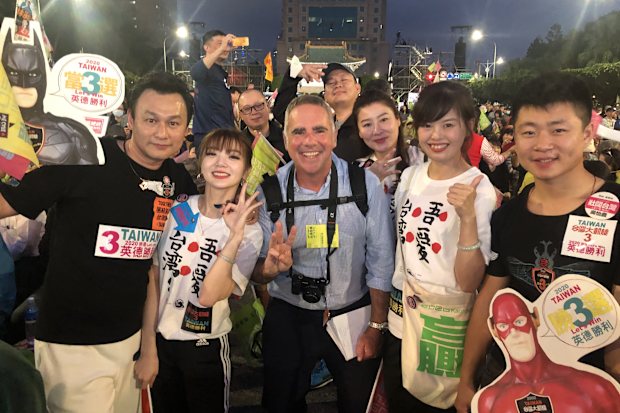 Michael Smith covering the Taiwan presidential elections in January 2020 with crowds of voters in Taipei.