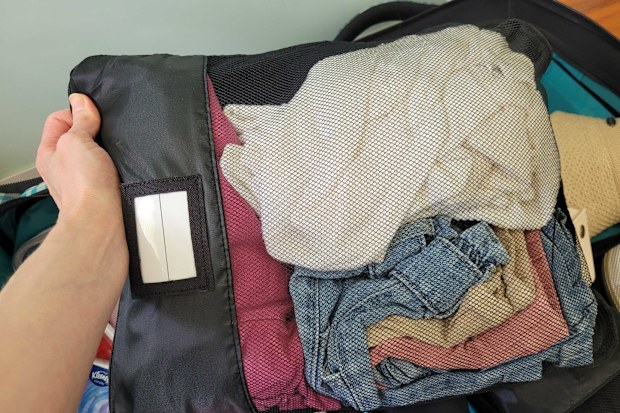 Kmart 19 piece travel organisation set compression bag with clothes inside