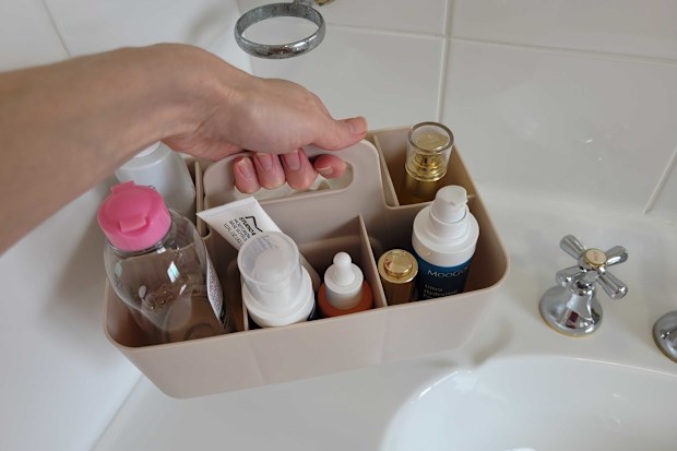 Kmart art and craft caddy used as a skincare organiser on bathroom vanity, which can be removed and put in the cabinet below